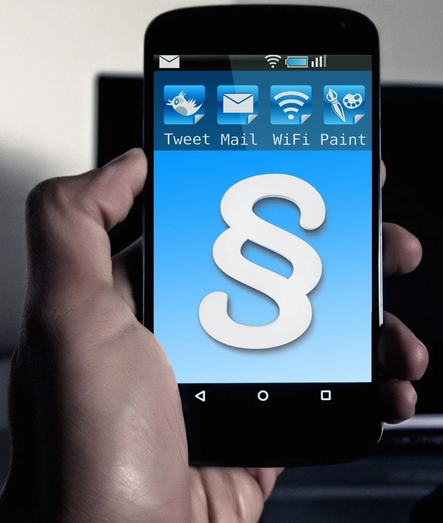 A black smartphone displaying a paragraph symbol and app icons for Tweet, Mail, WiFi, and Paint.